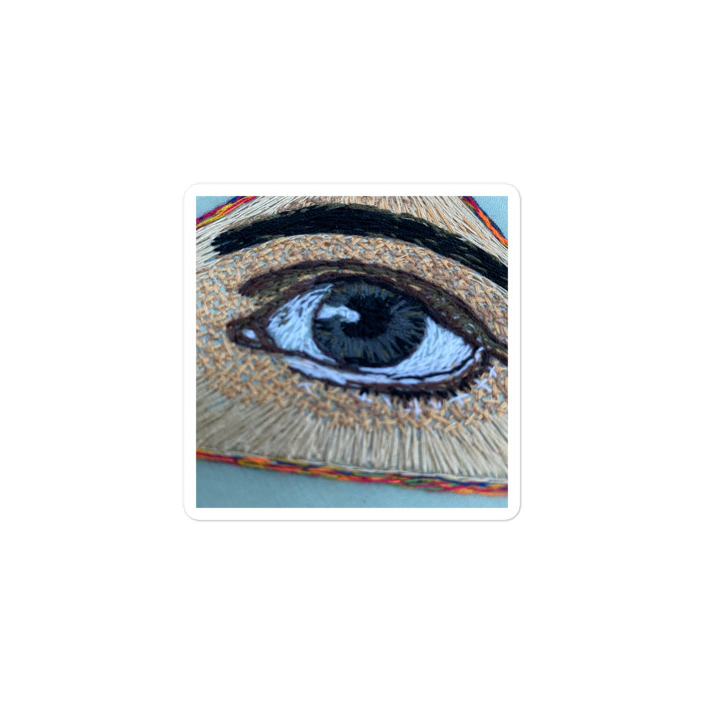 Hand-embroidered realistic all seeing eye with detailed thread work on bubble-free sticker