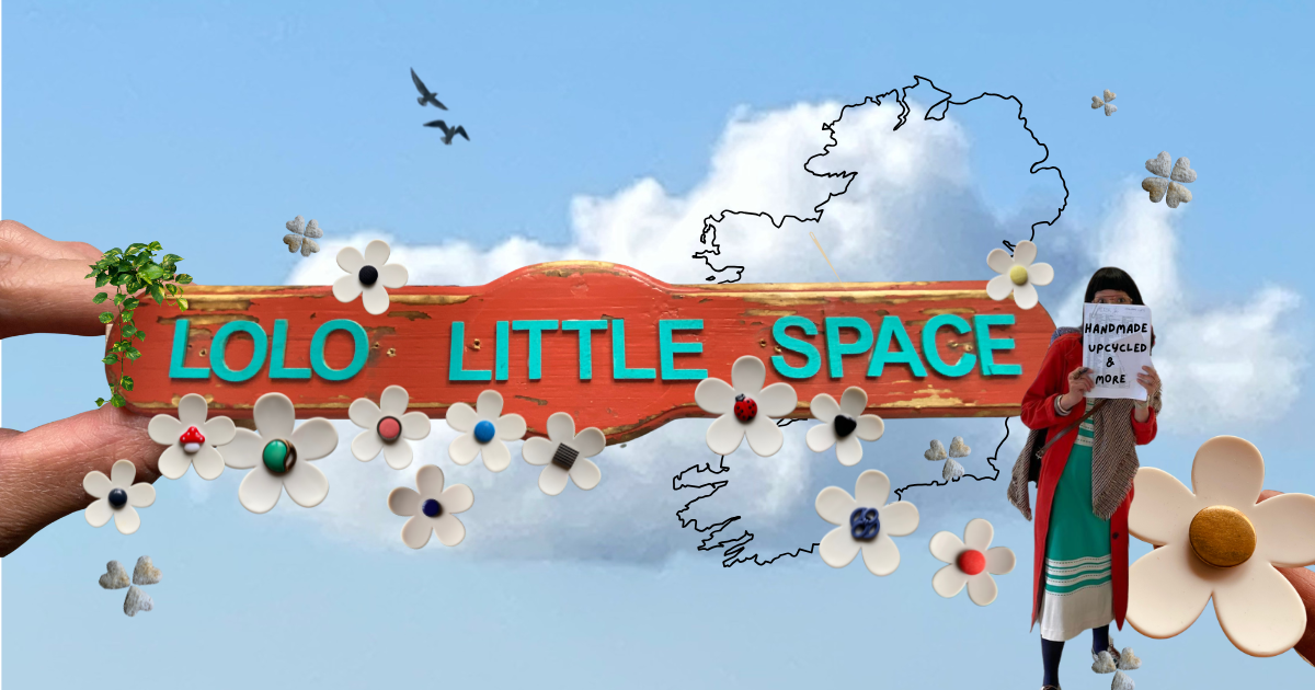 Handmade wooden sign reading 'Lolo Little Space' held over a person's face, featuring an outline of Ireland and daisy rings, with the tagline 'Handmade, Upcycled & More' against a blue sky with clouds.