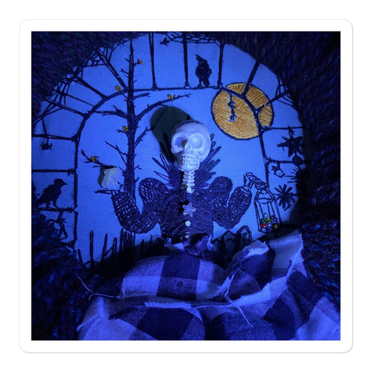 Hand-embroidered Victorian lady skeleton in black and white dress with gateway, crow, and orange moon