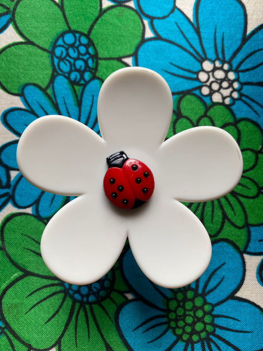 Handmade large daisy ring with white petals and ladybug button center