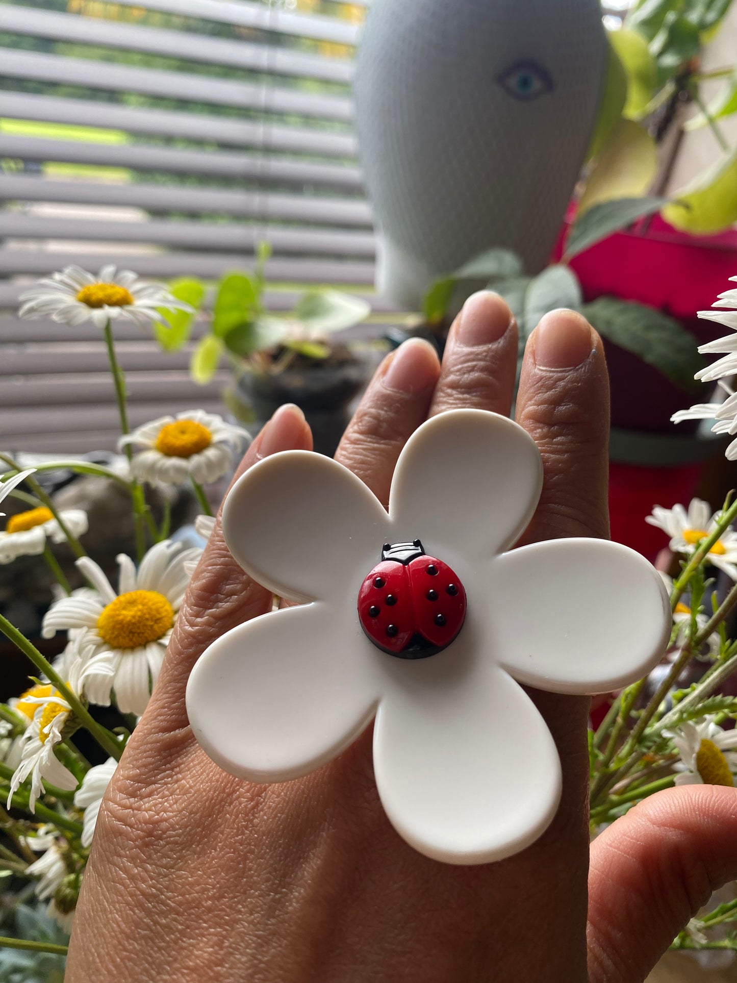 Handmade large daisy ring with white petals and ladybug button center