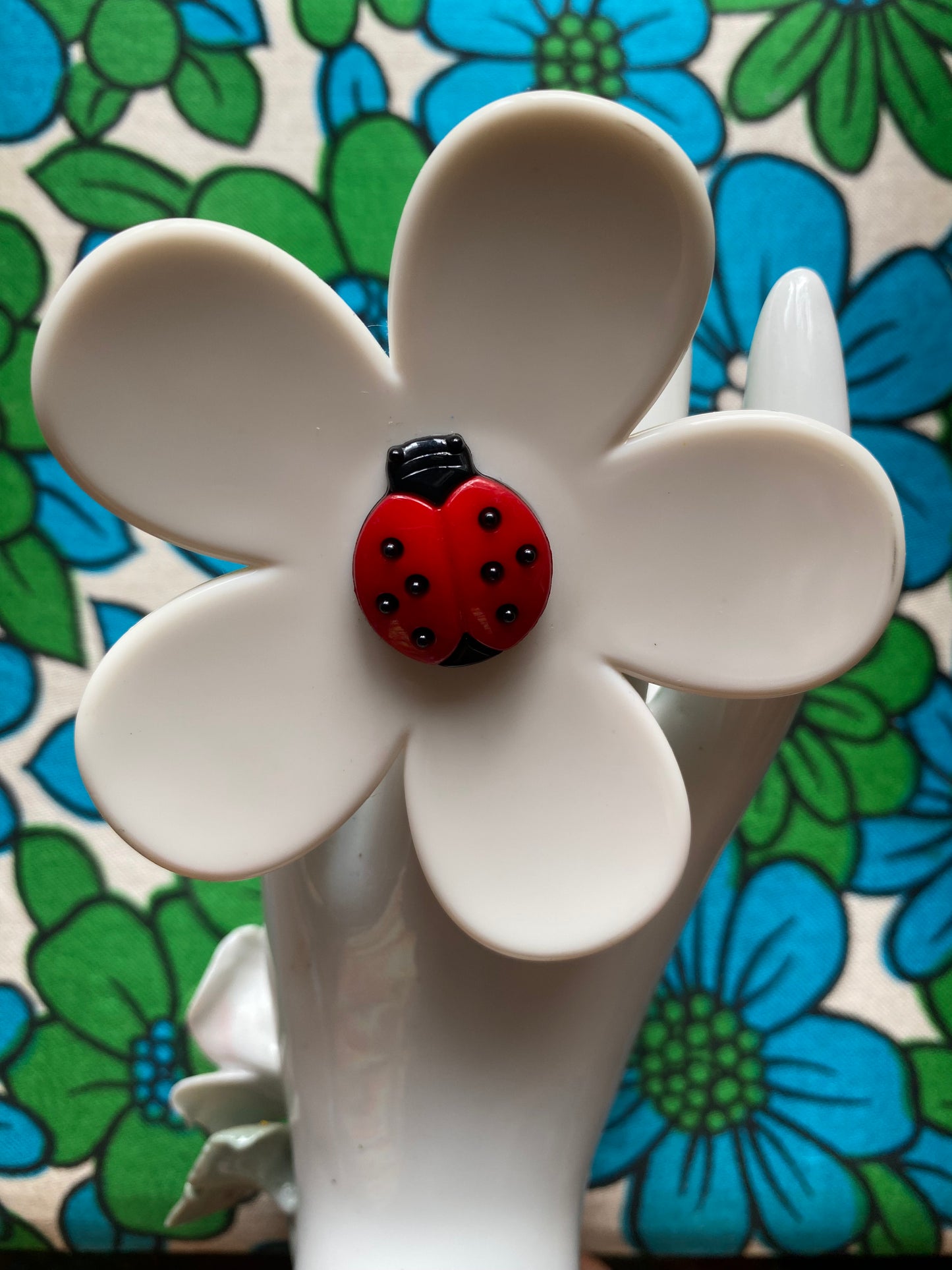 Handmade large daisy ring with white petals and ladybug button center