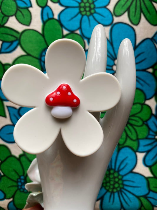 Handmade medium daisy ring with white petals and mushroom button center"