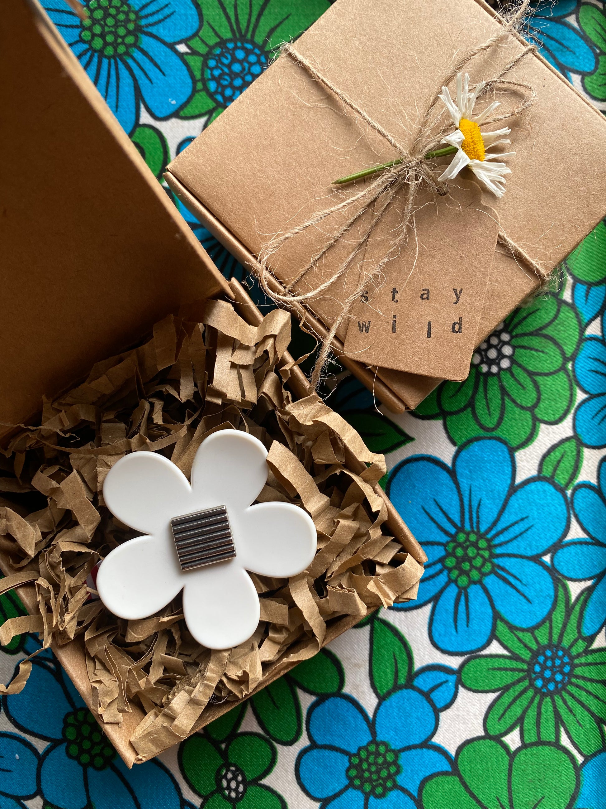 Handmade medium daisy ring with white petals and silver button center in a gift box 